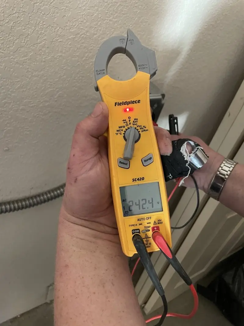 Voltage testing with clamp meter during Generator Installation in Circle D-KC Estates